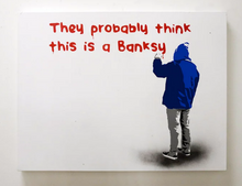 Art canvas - man painting a message on a wall